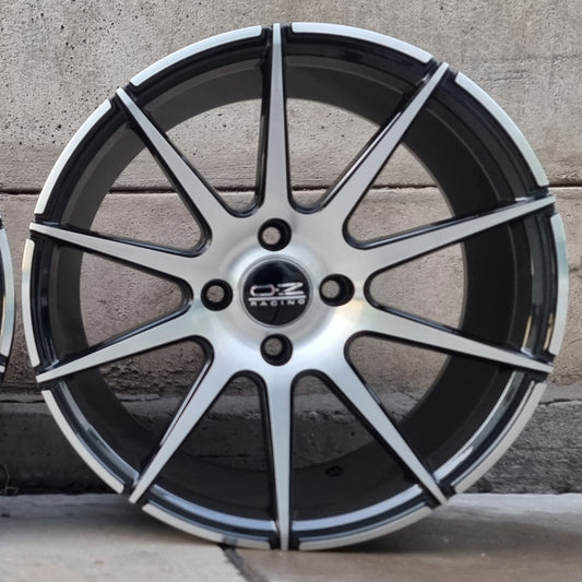 SET DE LLANTAS OZ ULTRA LIGERA. Aro 16 4x100. .Color Cromado Fondo Negro .(16N0184C).