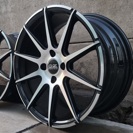 SET DE LLANTAS OZ RACING. Aro 16 - 4x100. Color Cromada Fondo Negro. (16N0184A)