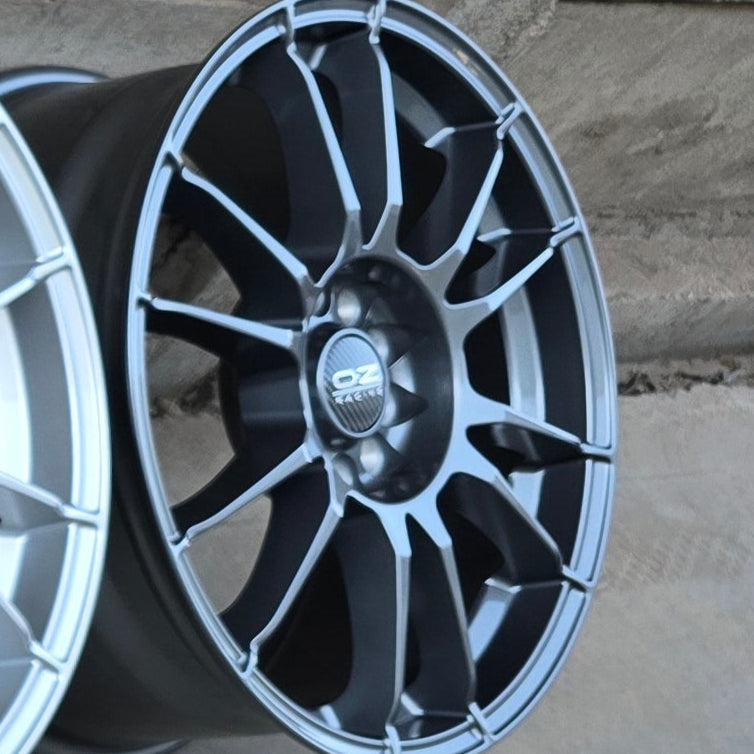 SET DE LLANTAS OZ ULTRA LIGERA. Aro 15-4x108 .Color Grafito .(320).
