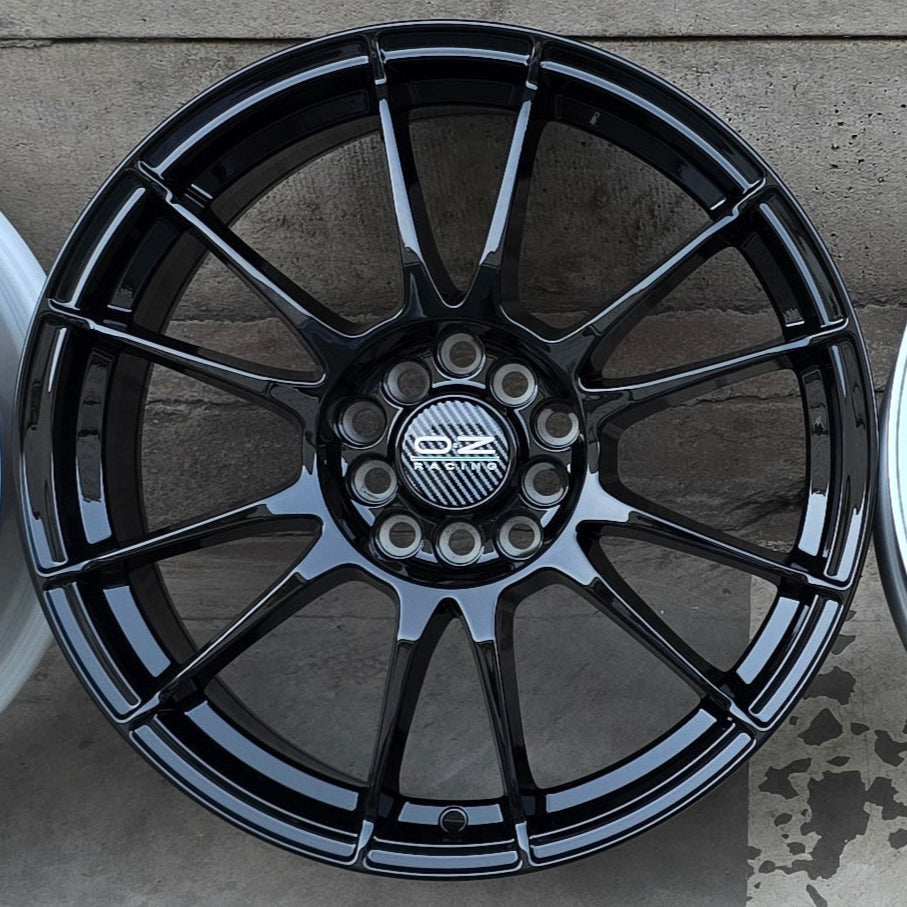 SET DE LLANTAS OZ ULTRA LIGERA. Aro 15-4x108. Color Negra Brillante. (320)