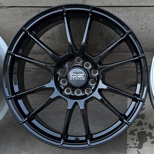 SET DE LLANTAS OZ ULTRA LIGERA. Aro 15-4x108. Color Negra Brillante. (320)